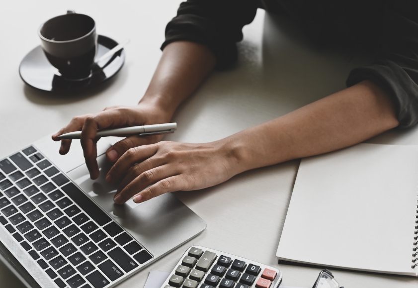 Hands typing on a laptop keyboard to find out more about Positive Duty to Prevent Sexual Harassment