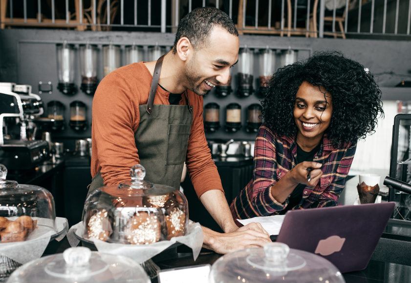 In a cafe, an employee and employer discussing reasonable additional hours at work